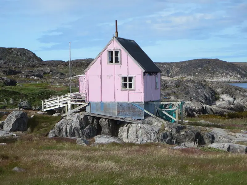 Small pink house on rocks in Itilleq, Greenland