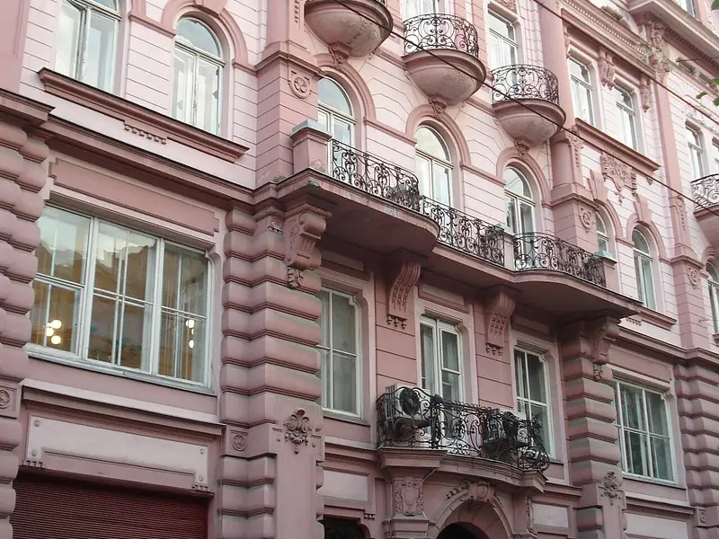 Pale pink house facade with balconies in Lviv, Ukraine